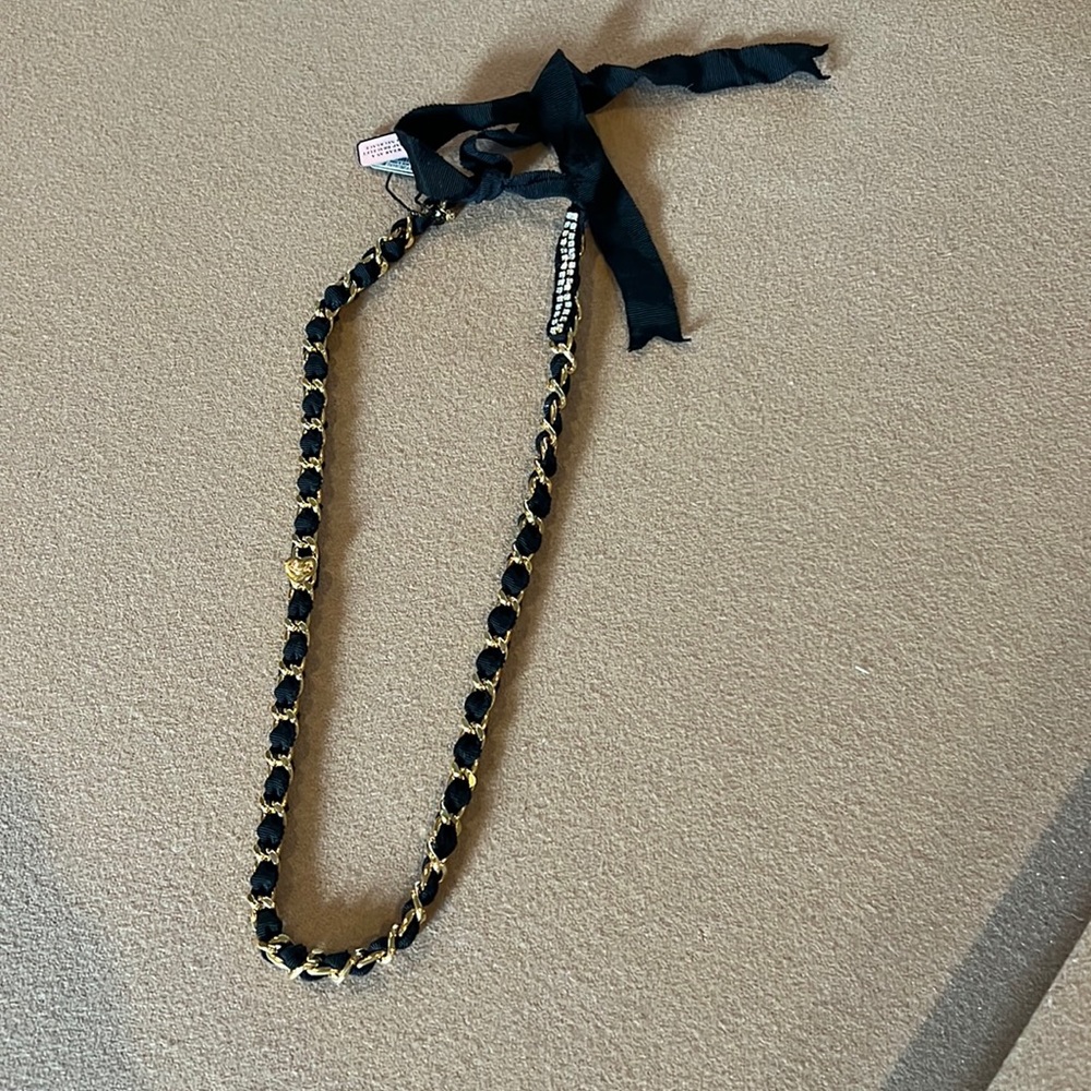 Juicy Couture tie necklace.  Can be worn as wrap bracelet.  NWT. Black & Gold